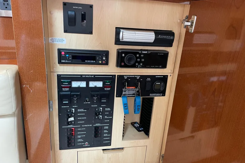 Catalyst Yacht Photos Pics Control panel of a 2009 Sea Ray 330 Sundancer boat, featuring various switches and meters.