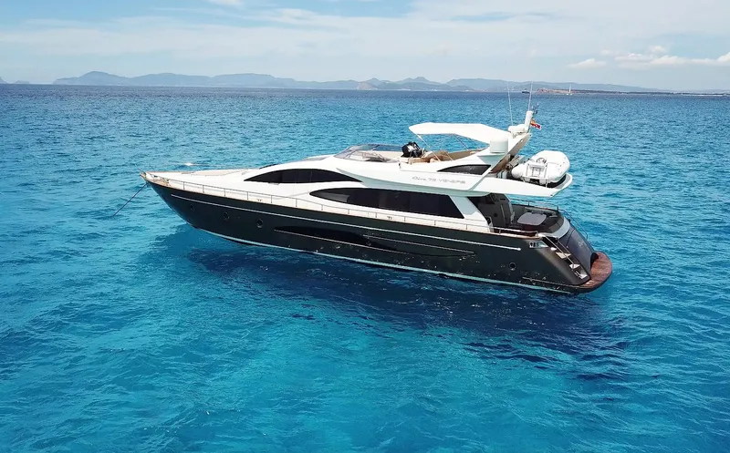 Polly Yacht Photos Pics Luxury 2009 Riva Venere 75 yacht cruising on clear blue ocean waters.