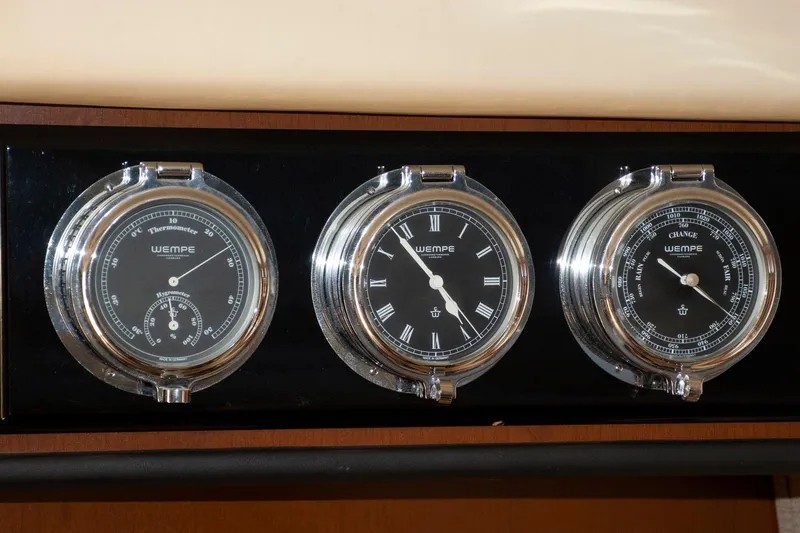 Still Waters Yacht Photos Pics Wempe instruments on 2007 Sea Ray 44 Sedan Bridge: thermometer, clock, barometer.