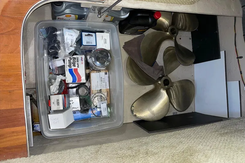 Still Waters Yacht Photos Pics Storage compartment of a 2007 Sea Ray 44 Sedan Bridge with spare parts and propellers.