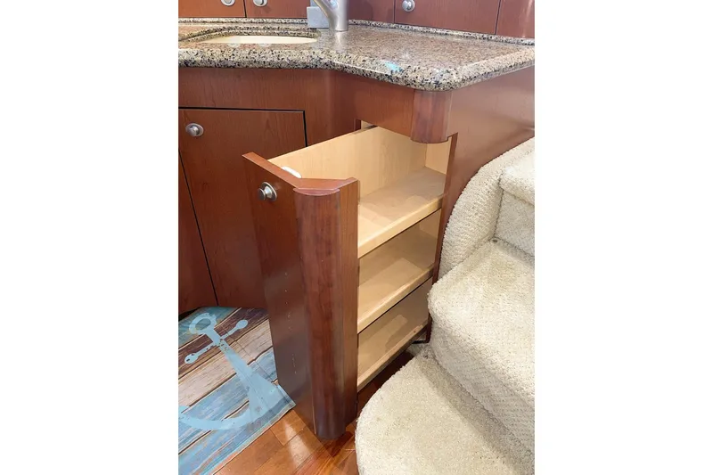 Still Waters Yacht Photos Pics Pull-out wooden cabinet in 2007 Sea Ray 44 Sedan Bridge yacht kitchen.