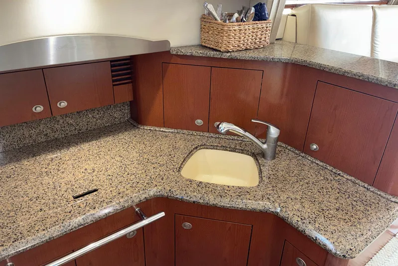 Still Waters Yacht Photos Pics Luxurious kitchen area in 2007 Sea Ray 44 Sedan Bridge yacht with granite countertops.
