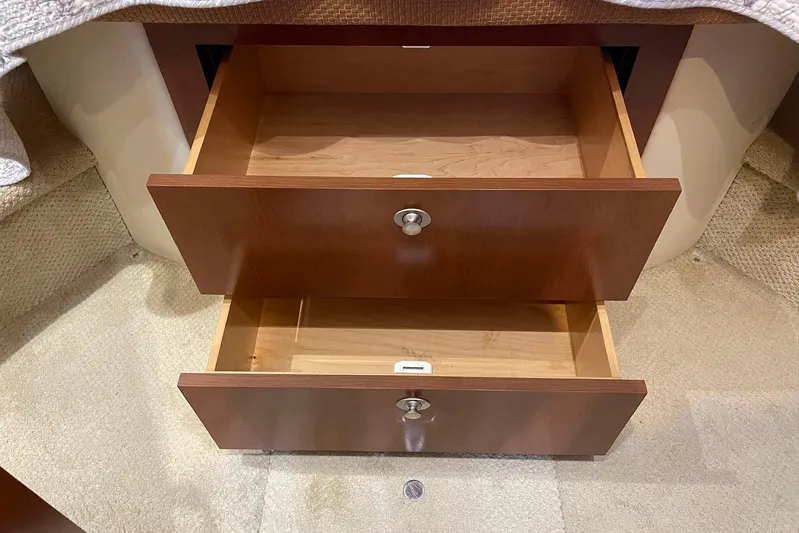 Still Waters Yacht Photos Pics Open wooden drawers inside a 2007 Sea Ray 44 Sedan Bridge yacht.