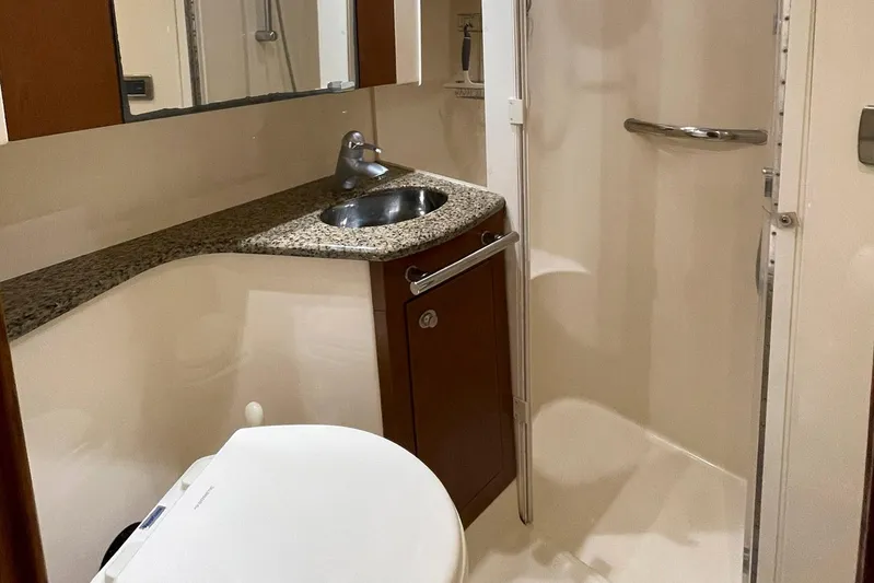 Still Waters Yacht Photos Pics Luxurious bathroom in 2007 Sea Ray 44 Sedan Bridge yacht with granite countertop.