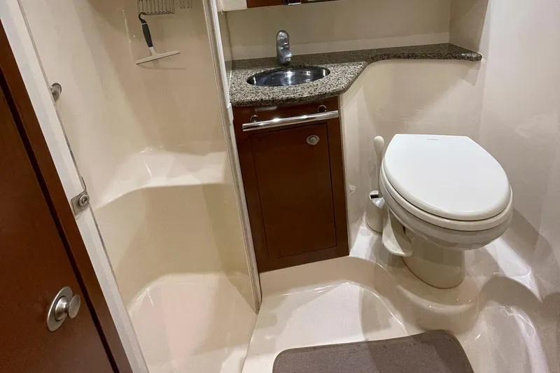 Still Waters Yacht Photos Pics 2007 Sea Ray 44 Sedan Bridge bathroom with shower, sink, and toilet.