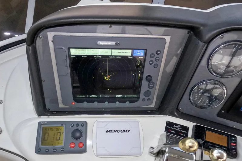 Still Waters Yacht Photos Pics Control panel of a 2007 Sea Ray 44 Sedan Bridge with navigation and engine gauges.