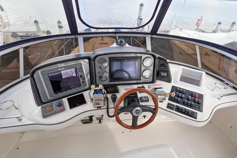 Still Waters Yacht Photos Pics 2007 Sea Ray 44 Sedan Bridge helm with advanced navigation controls and panoramic view.