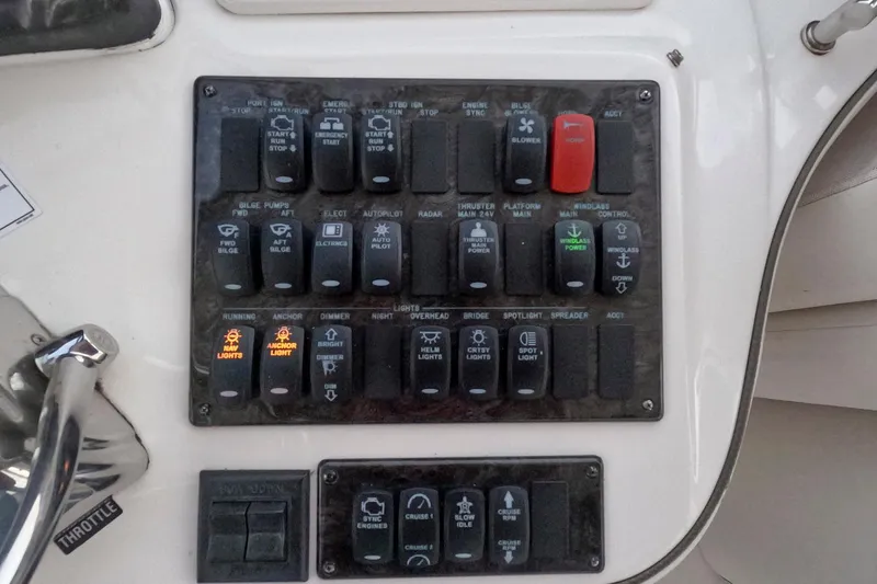 Still Waters Yacht Photos Pics Control panel of a 2007 Sea Ray 44 Sedan Bridge yacht with various switches.