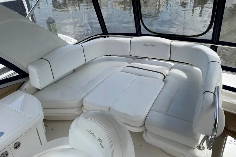 Still Waters Yacht Photos Pics Luxurious white seating on 2007 Sea Ray 44 Sedan Bridge yacht.