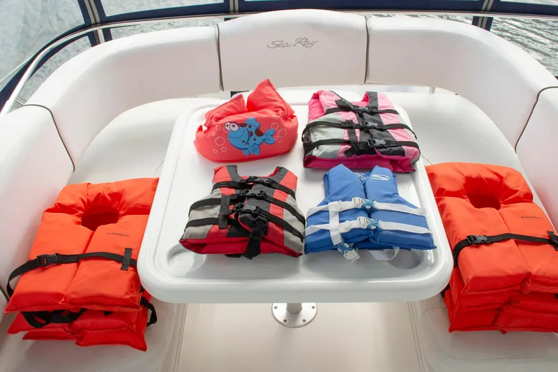 Still Waters Yacht Photos Pics Life jackets on a 2007 Sea Ray 44 Sedan Bridge boat's seating area.