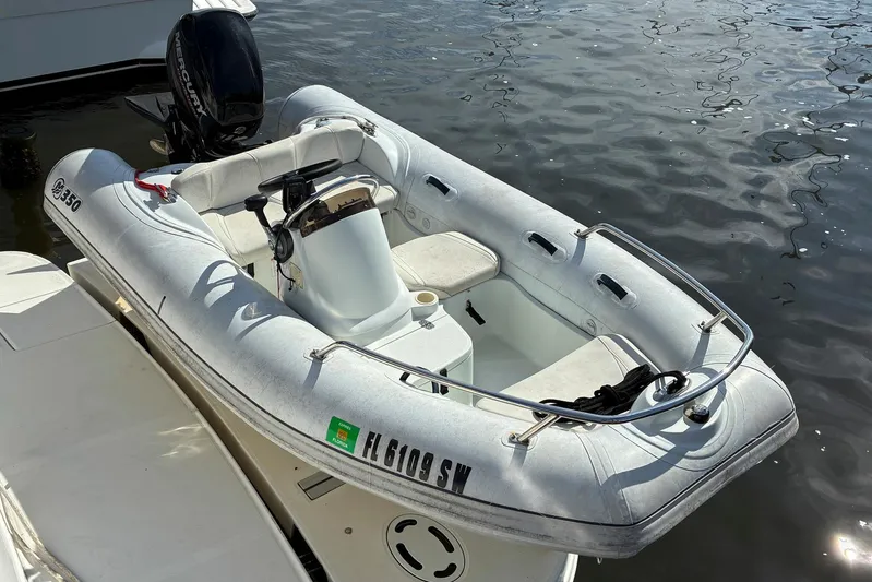 Still Waters Yacht Photos Pics Inflatable boat with Mercury outboard motor docked beside a 2007 Sea Ray 44 Sedan Bridge.