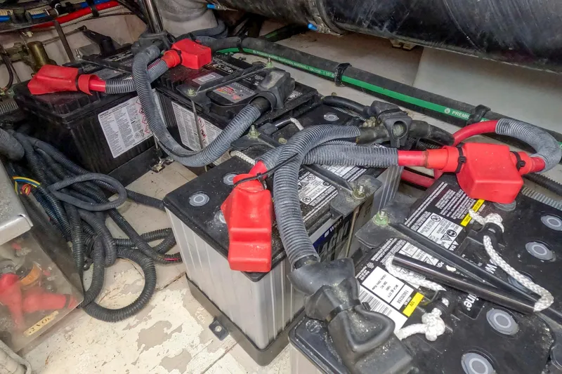 Still Waters Yacht Photos Pics Battery compartment of a 2007 Sea Ray 44 Sedan Bridge with connected cables.