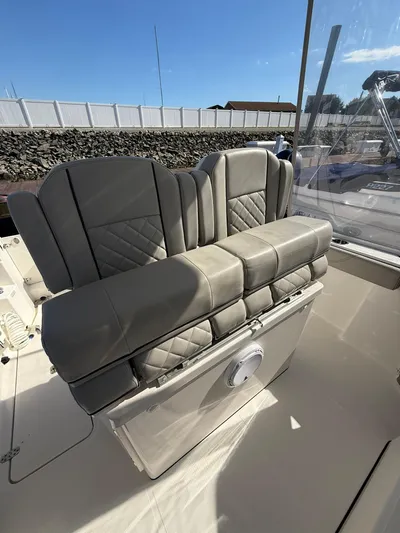  Yacht Photos Pics 2023 Pursuit S 268 Sport boat with luxurious gray seating and sleek design.