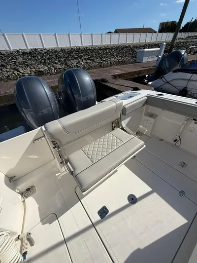  Yacht Photos Pics 2023 Pursuit S 268 Sport boat with dual engines and cushioned seating.
