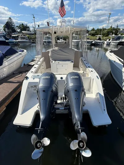  Yacht Photos Pics 2023 Pursuit S 268 Sport boat with dual engines docked at marina.