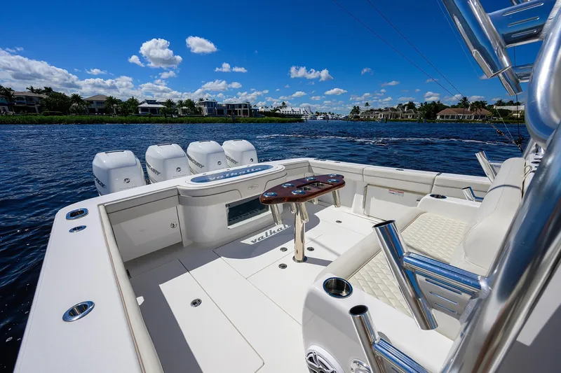 Miss Allied Yacht Photos Pics Valhalla V41 2022 boat interior with seating and fishing rod holders on a sunny day.