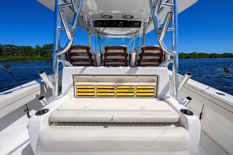 Miss Allied Yacht Photos Pics 2022 Valhalla V41 boat interior with seating and storage, on a sunny day.