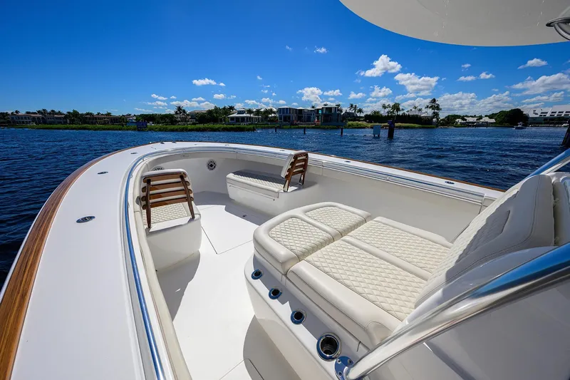 Miss Allied Yacht Photos Pics Luxurious 2022 Valhalla V41 boat interior with plush seating on a sunny day.