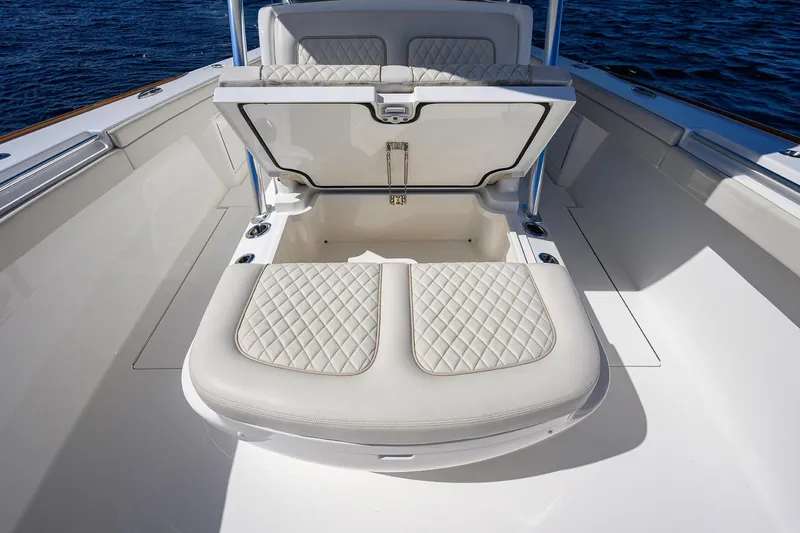 Miss Allied Yacht Photos Pics 2022 Valhalla V41 boat with open storage compartment and quilted seating.