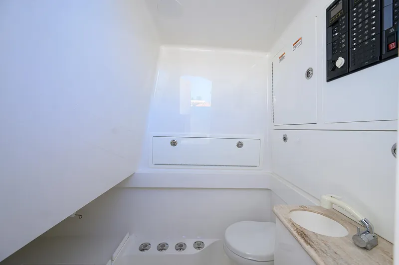 Miss Allied Yacht Photos Pics 2022 Valhalla V41 boat bathroom with modern fixtures and control panel.