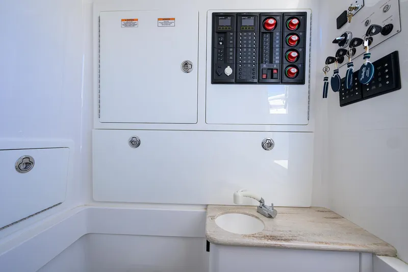 Miss Allied Yacht Photos Pics 2022 Valhalla V41 boat interior with control panel and sink area.