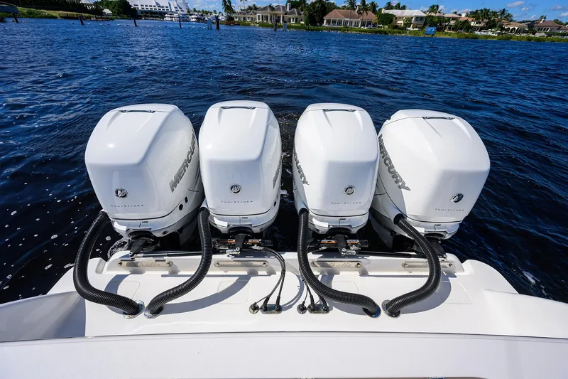 Miss Allied Yacht Photos Pics Four Mercury outboard engines on a 2022 Valhalla V41 boat, cruising on blue water.