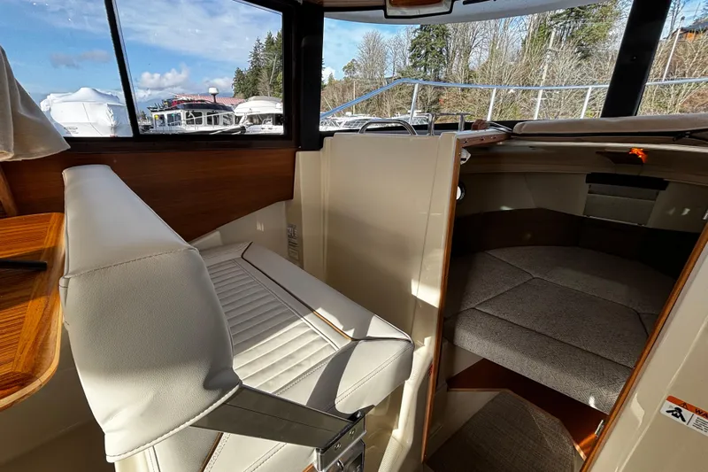  Yacht Photos Pics 2026 Ranger Tugs R-23 interior with seating and cabin view.