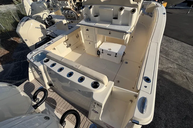  Yacht Photos Pics 2026 Scout 260 LXF boat interior with storage and seating, featuring Mercury engines.
