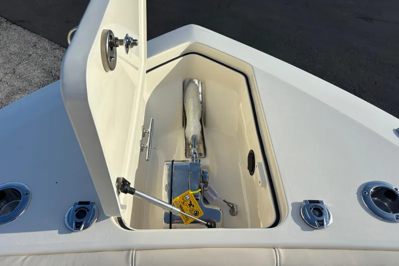  Yacht Photos Pics Open anchor compartment on 2026 Scout 260 LXF boat, showcasing storage and hardware.