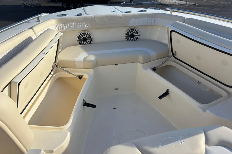 Yacht Photos Pics 2026 Scout 260 LXF boat interior with open storage compartments and seating.