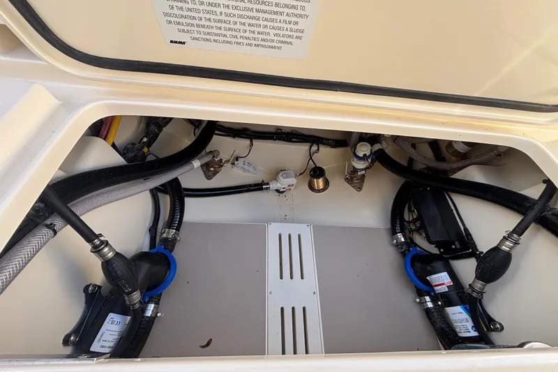  Yacht Photos Pics 2026 Scout 260 LXF boat interior showing engine compartment and wiring.