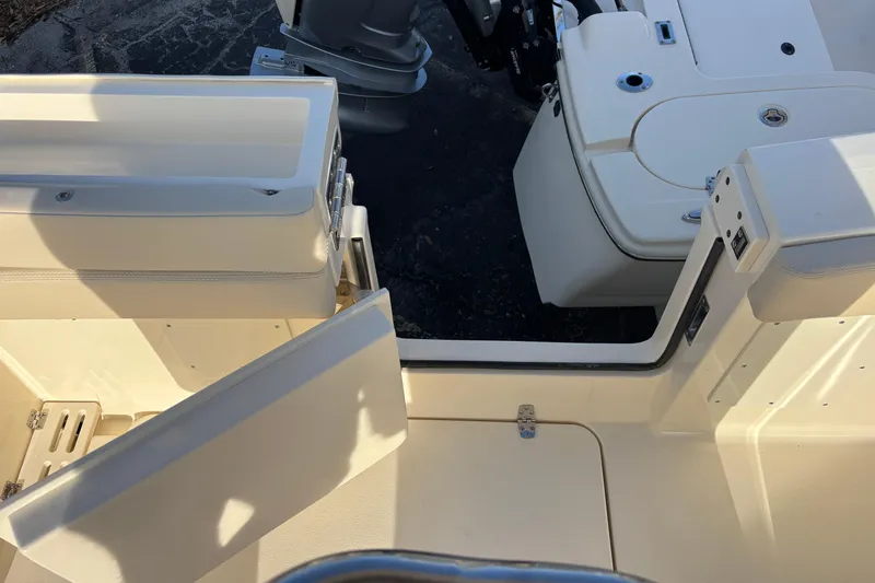  Yacht Photos Pics 2026 Scout 260 LXF boat interior with open hatch and seating area.