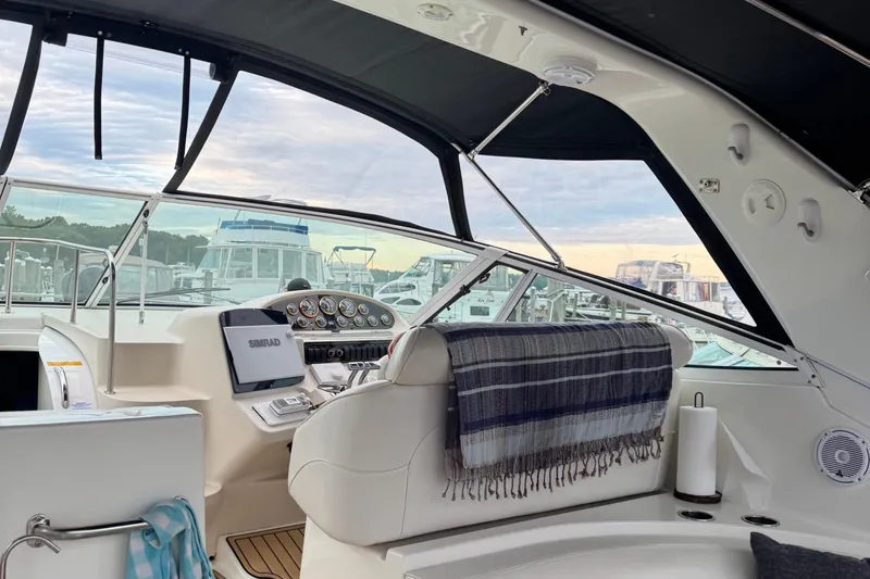 Lubb Shack Yacht Photos Pics Interior of 2000 Cruisers Yachts 3870 Express with helm, controls, and seating.