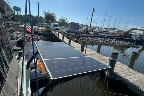 Godspeed Yacht Photos Pics 2023 Nautitech 44 Open catamaran with solar panels docked at a marina.