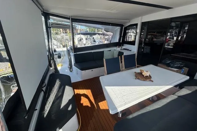 Godspeed Yacht Photos Pics 2023 Nautitech 44 Open yacht interior with seating and dining area, featuring modern design.