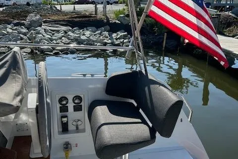 Godspeed Yacht Photos Pics Helm station of 2023 Nautitech 44 Open catamaran with American flag in marina.