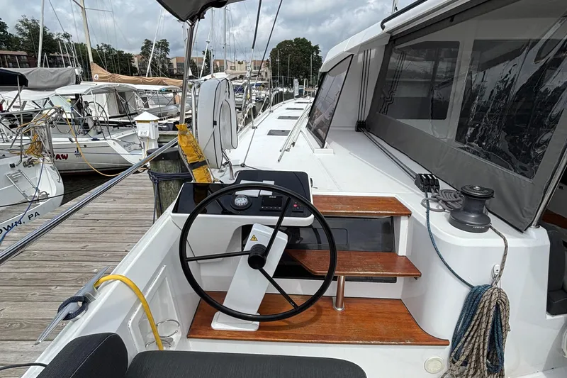 Godspeed Yacht Photos Pics 2023 Nautitech 44 Open yacht helm station at marina, showcasing sleek design and modern features.