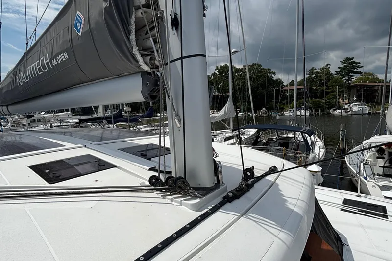 Godspeed Yacht Photos Pics 2023 Nautitech 44 Open catamaran docked at a marina under cloudy skies.