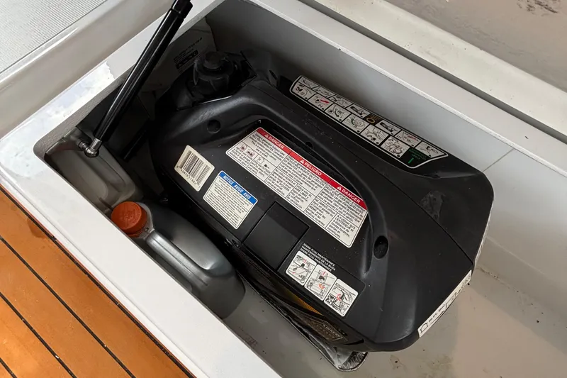 Godspeed Yacht Photos Pics Engine compartment of 2023 Nautitech 44 Open, featuring detailed safety and operation labels.