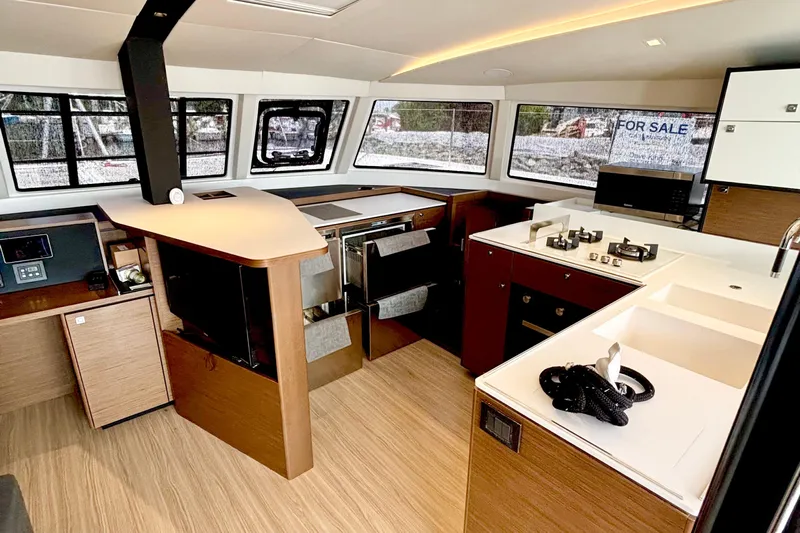 Godspeed Yacht Photos Pics Modern interior of 2023 Nautitech 44 Open yacht with sleek kitchen design.
