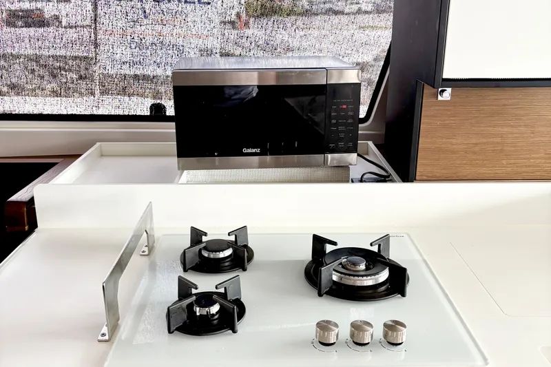 Godspeed Yacht Photos Pics Modern kitchen in 2023 Nautitech 44 Open yacht with stove and microwave.