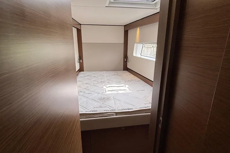 Godspeed Yacht Photos Pics 2023 Nautitech 44 Open cabin interior with bed and window view.