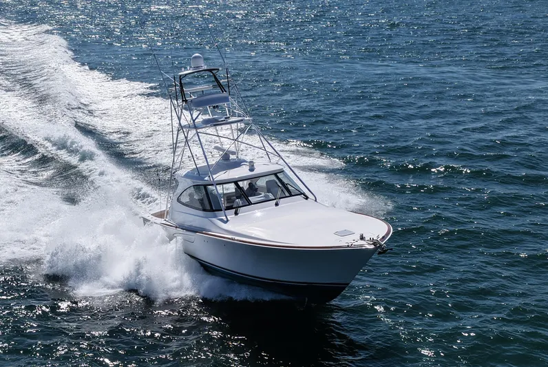 Pamela Yacht Photos Pics 2024 Viking 48 Sport Tower yacht cruising on open water.