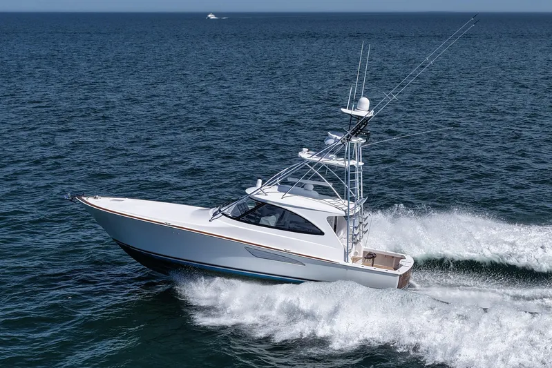 Pamela Yacht Photos Pics 2024 Viking 48 Sport Tower yacht cruising on open sea.