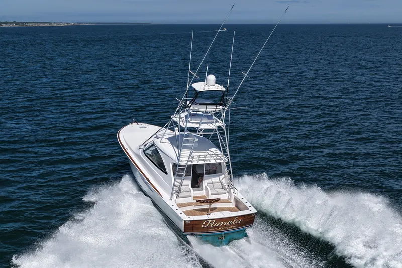 Pamela Yacht Photos Pics 2024 Viking 48 Sport Tower yacht cruising on open sea.