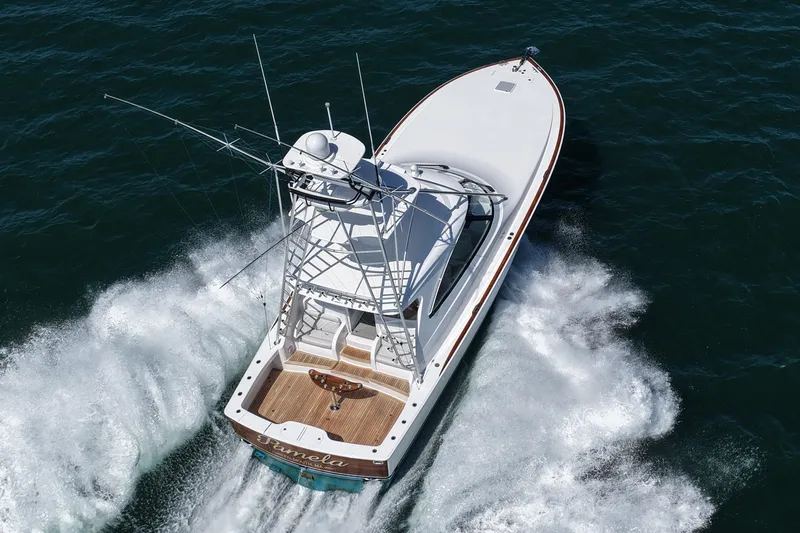 Pamela Yacht Photos Pics 2024 Viking 48 Sport Tower cruising on open water, aerial view.