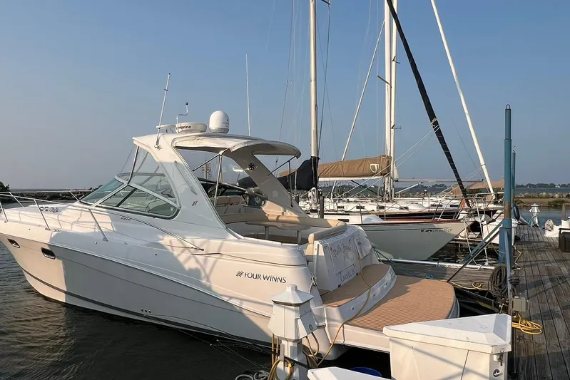  Yacht Photos Pics 2008 Four Winns 378 Vista yacht docked at marina, surrounded by sailboats.