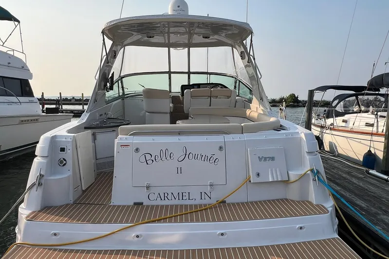  Yacht Photos Pics 2008 Four Winns 378 Vista yacht docked, rear view with seating and "Belle Journée" name.