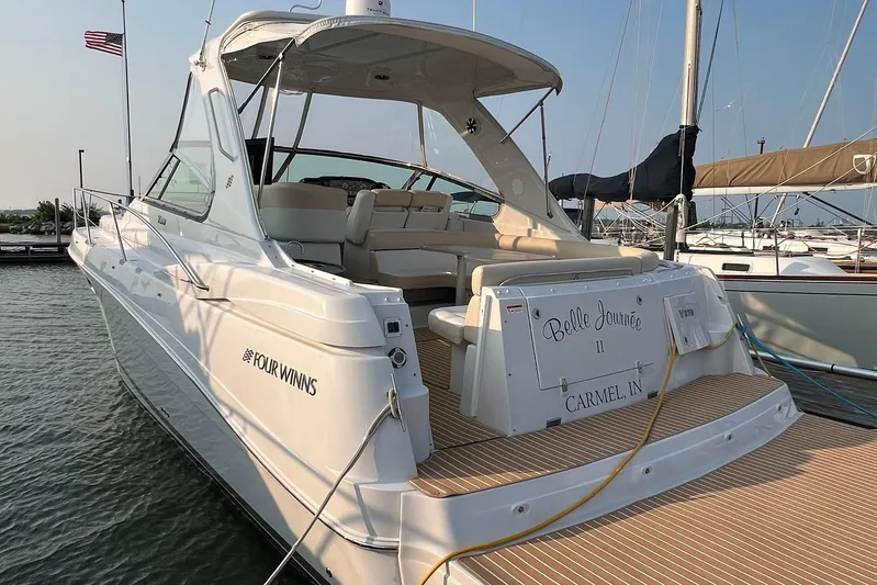  Yacht Photos Pics 2008 Four Winns 378 Vista yacht docked, featuring spacious seating and elegant design.