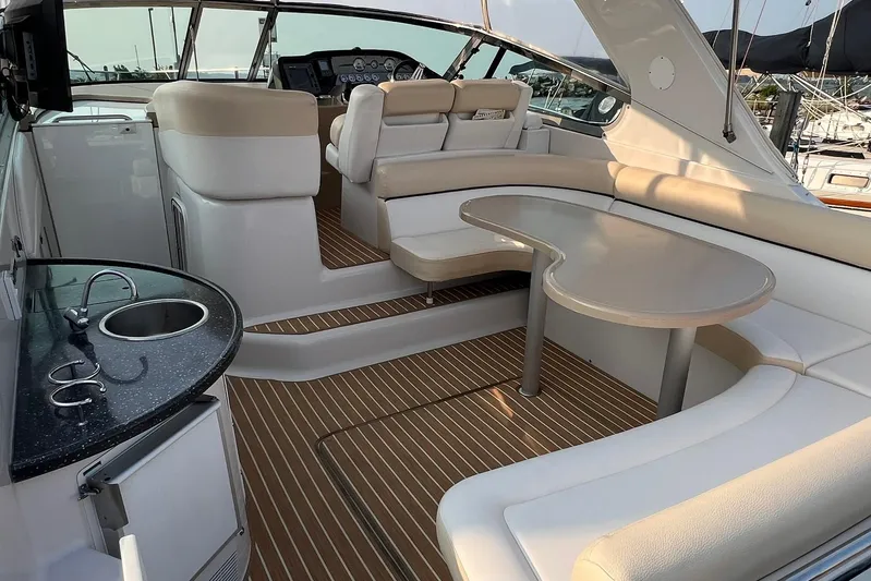  Yacht Photos Pics Luxurious 2008 Four Winns 378 Vista yacht interior with seating, table, and kitchenette.